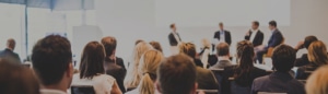 Audience members sit facing a panel of four people speaking at the front of a conference room, where the discussion centers on how BFR Is Becoming More Selective. Here’s What That Means for the Market—a topic generating keen interest and insightful questions from attendees.